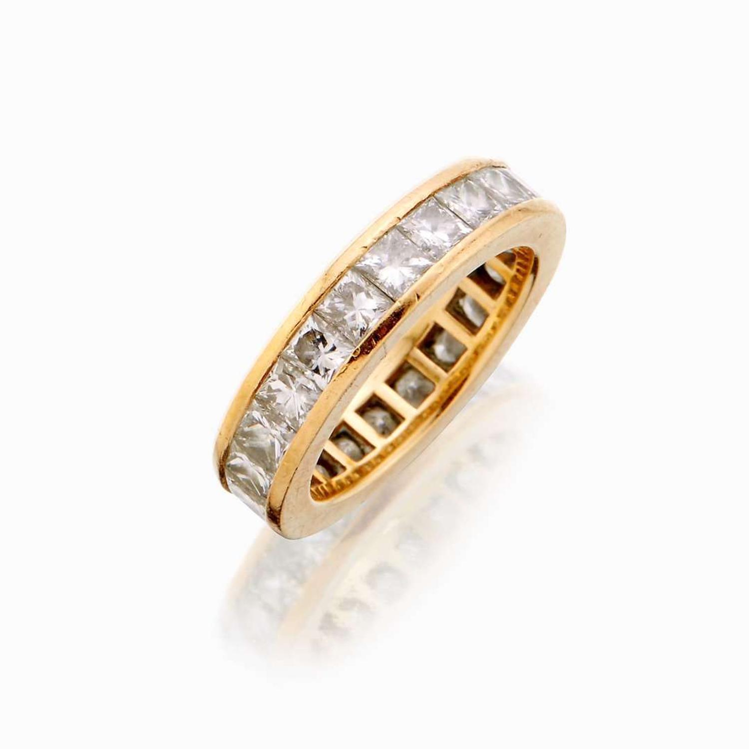 An eighteen karat gold and diamond eternity band