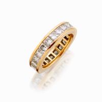 An eighteen karat gold and diamond eternity band