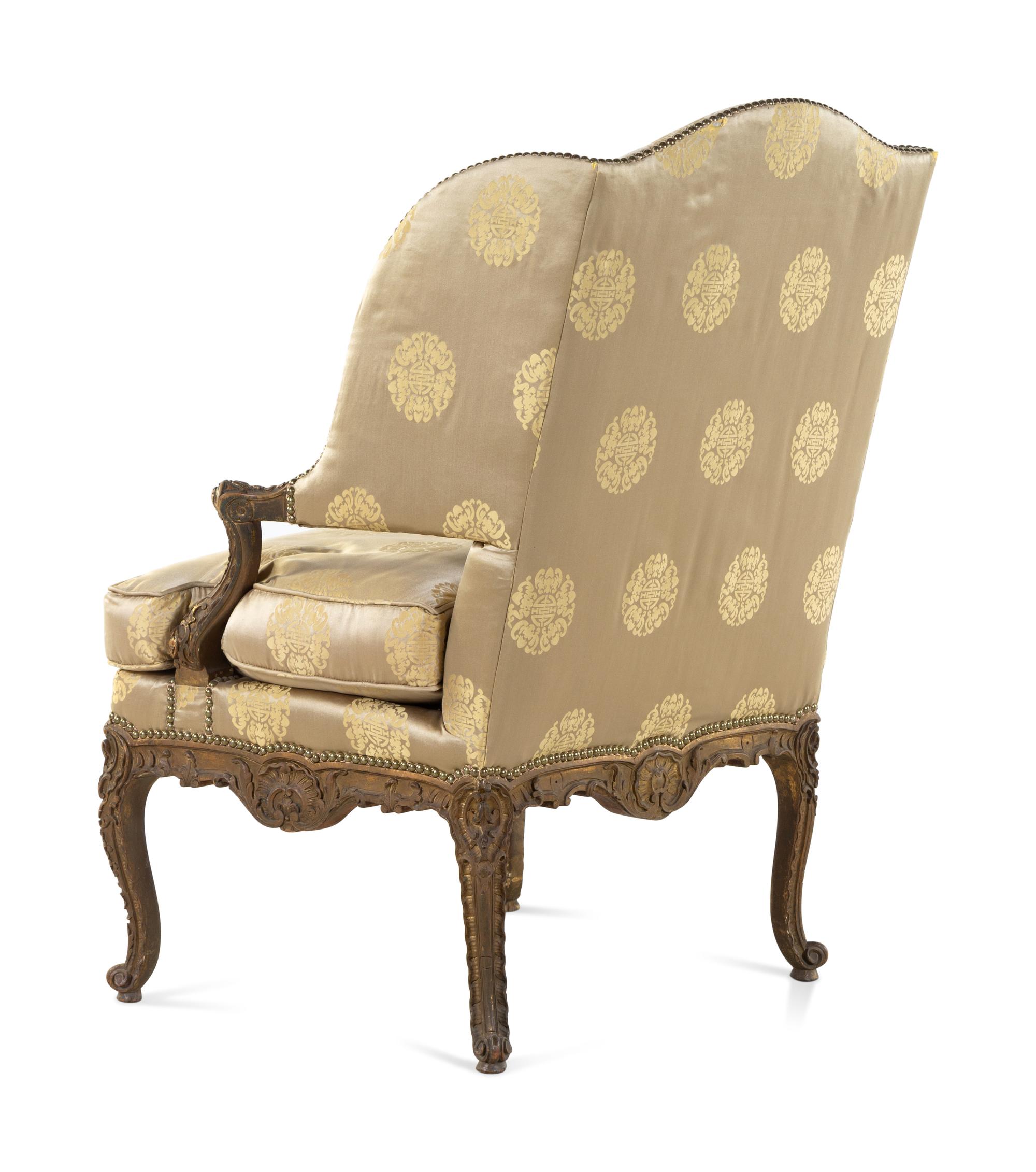 A Louis XV Style Carved and Giltwood Fauteuil à Oreilles