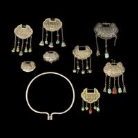 A Chinese Silver Necklace and Eight Chinese Silver Ruyi Lock-Form Pendants, Qing Dynasty 清 銀項圈一及銀如意頭形長命鎖一組八件