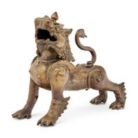 An Indian or Southeast Asian Brass Temple Lion