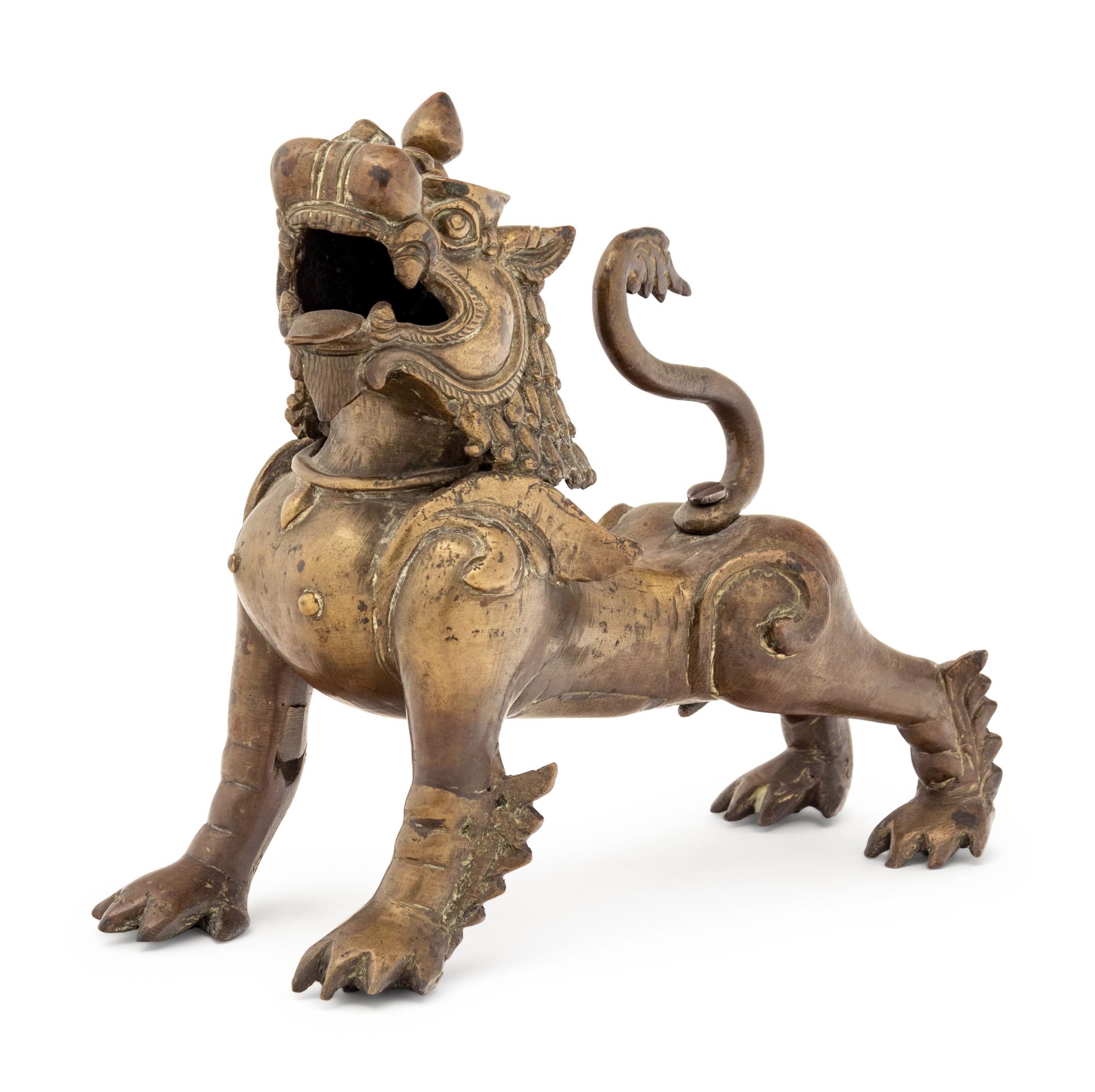 An Indian or Southeast Asian Brass Temple Lion