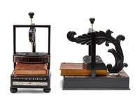 A Pair of Regency Style Ebony and Rosewood Book Presses
