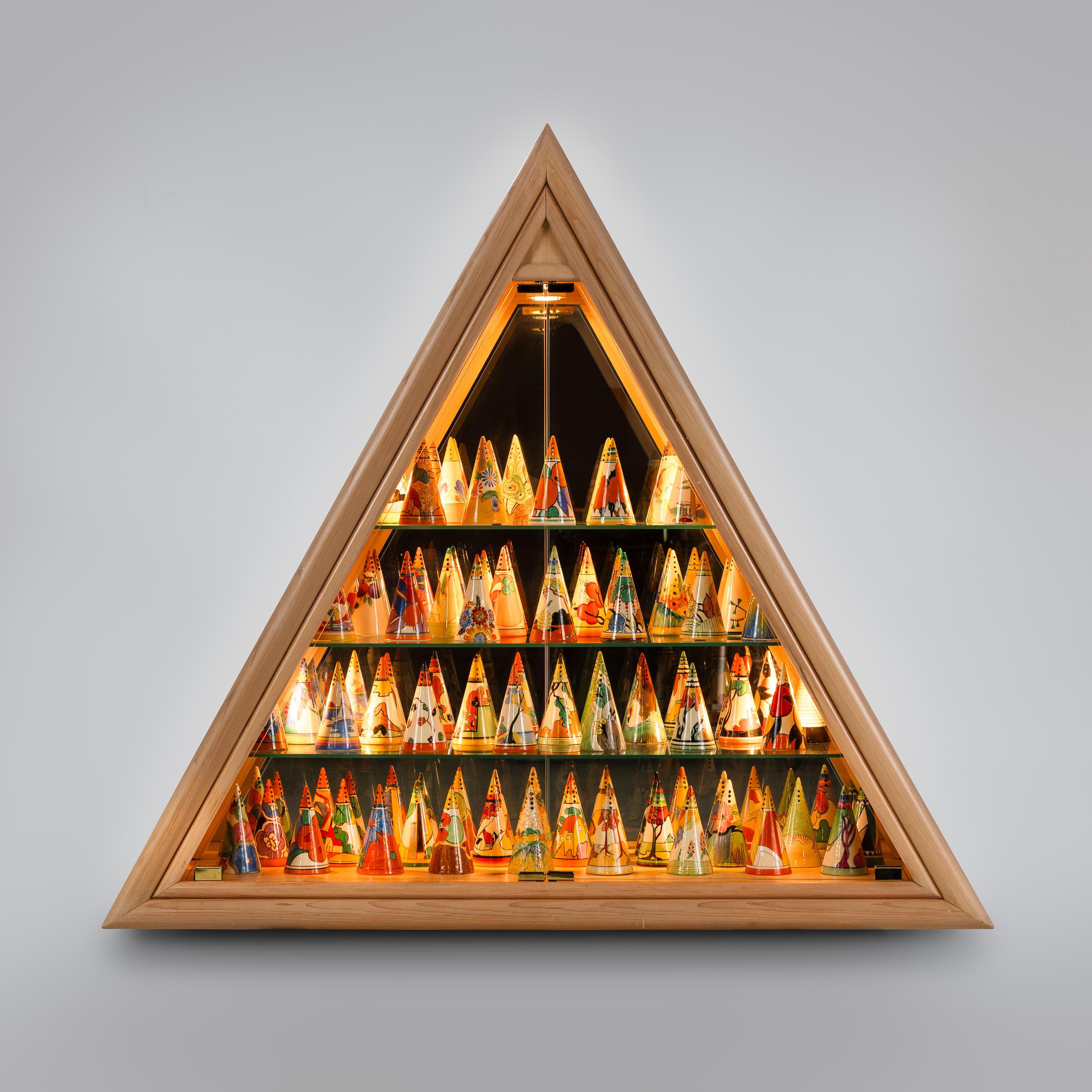 Clarice Cliff (English, 1899–1972) — Collection of 57 Conical Sugar Shakers and Custom Case