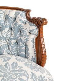 A Rococo Revival Carved Walnut Armchair