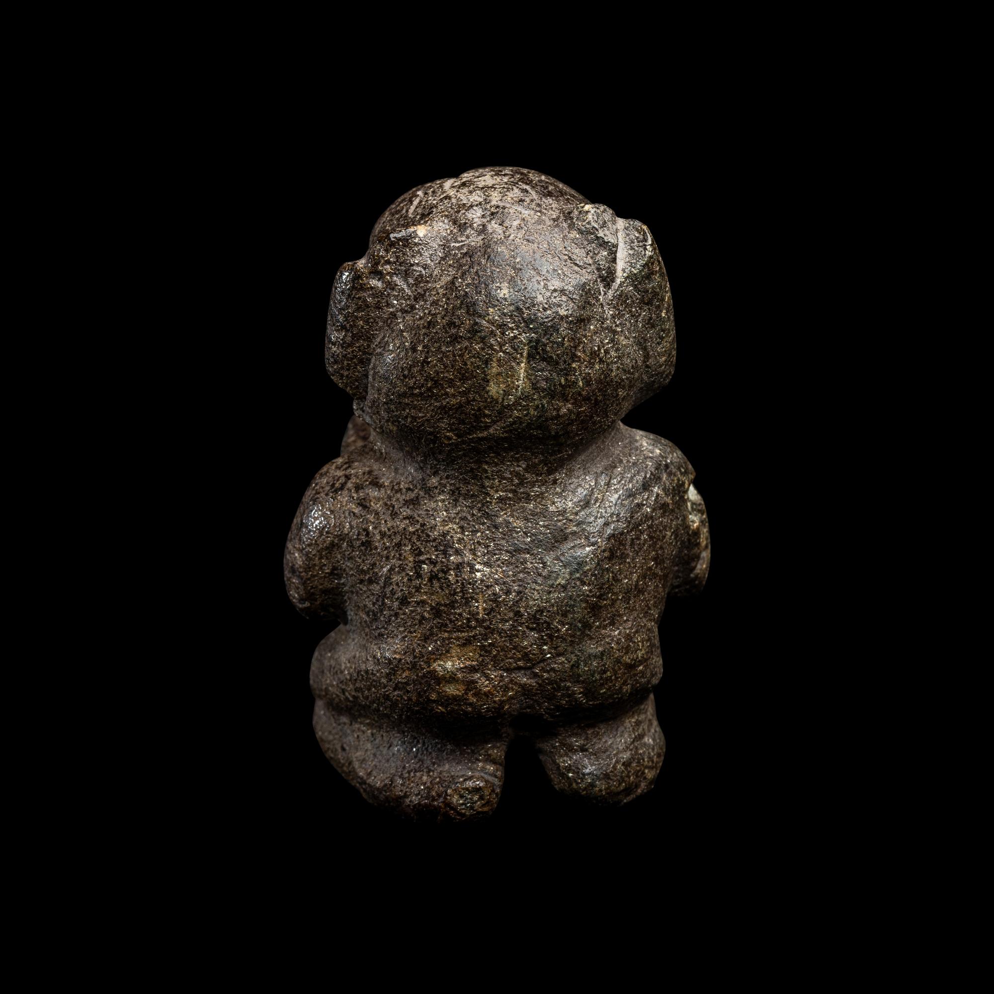 An Olmec Serpentine Kneeling Transformation Figure