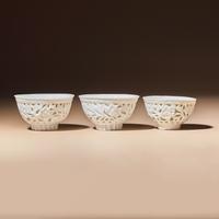 Three Chinese Blanc-de-Chine Porcelain Reticulated 'Floral' Cups, Mid 17th-Early 18th Century — 清中期 德化白瓷鏤雕花卉紋杯三隻
