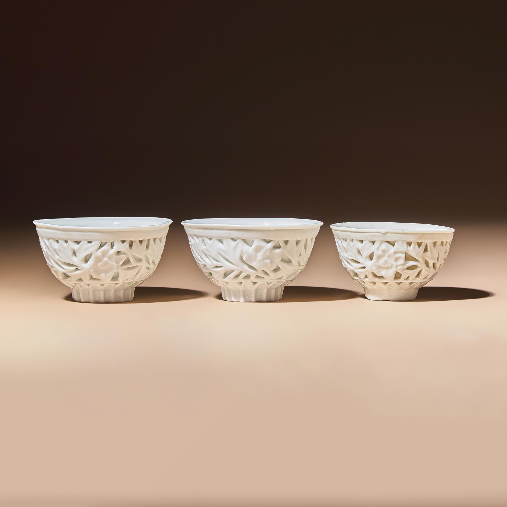 Three Chinese Blanc-de-Chine Porcelain Reticulated 'Floral' Cups, Mid 17th-Early 18th Century — 清中期 德化白瓷鏤雕花卉紋杯三隻