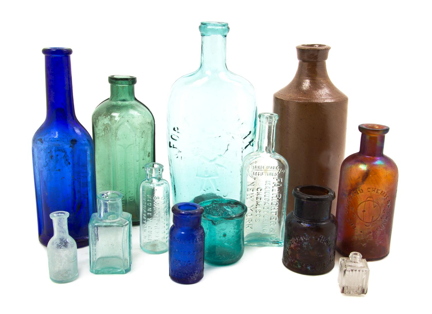 Eleven American Glass Bottles, Height of tallest 7 3/4 inches.