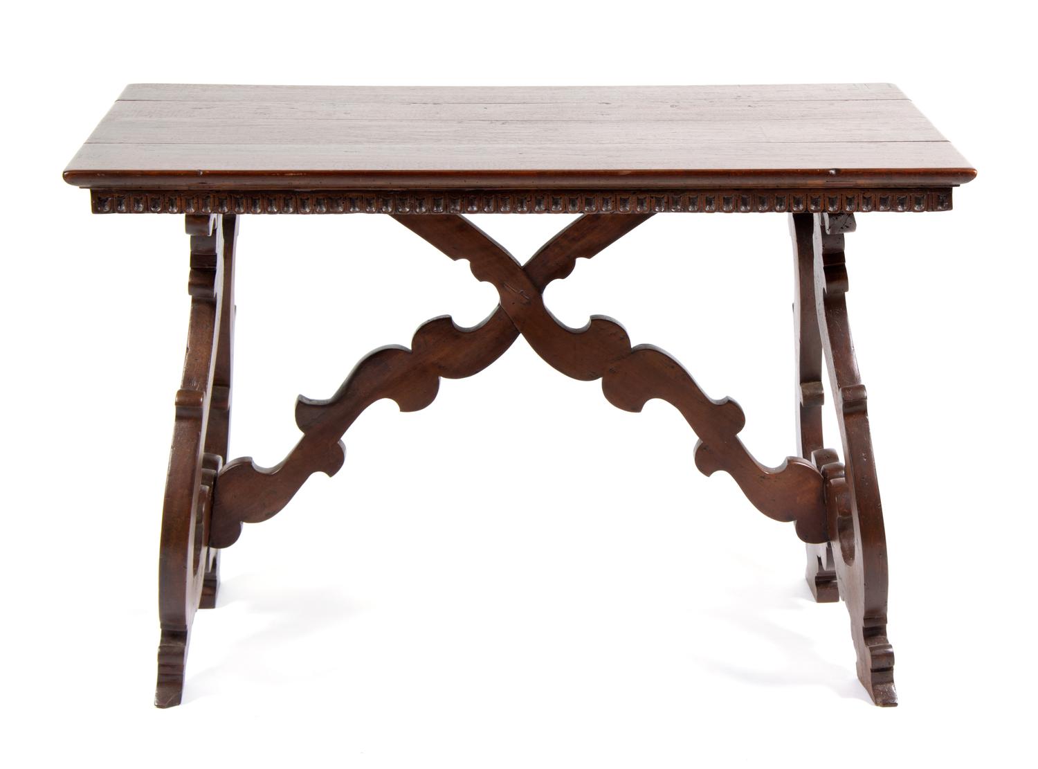 A Spanish Baroque Style Walnut Trestle Table Height 30 x width 46 1/2 x depth 28 1/4 inches.