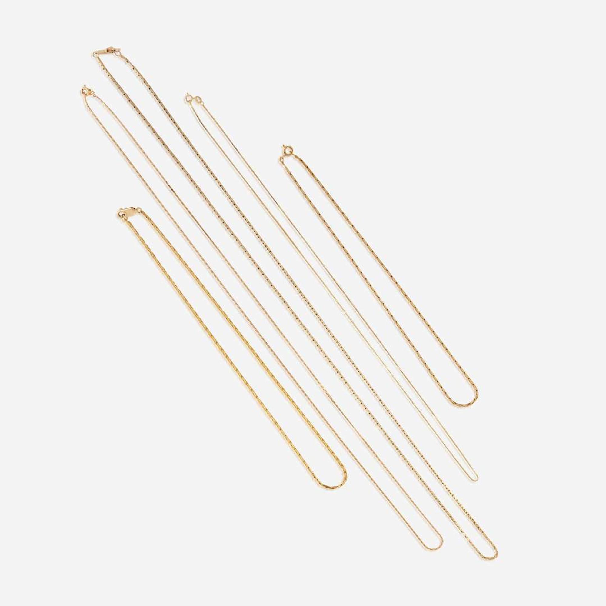 A collection of five fourteen karat gold necklaces
