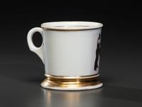 A Photographic Transfer Shaving Mug Depicting a Printer at his Press