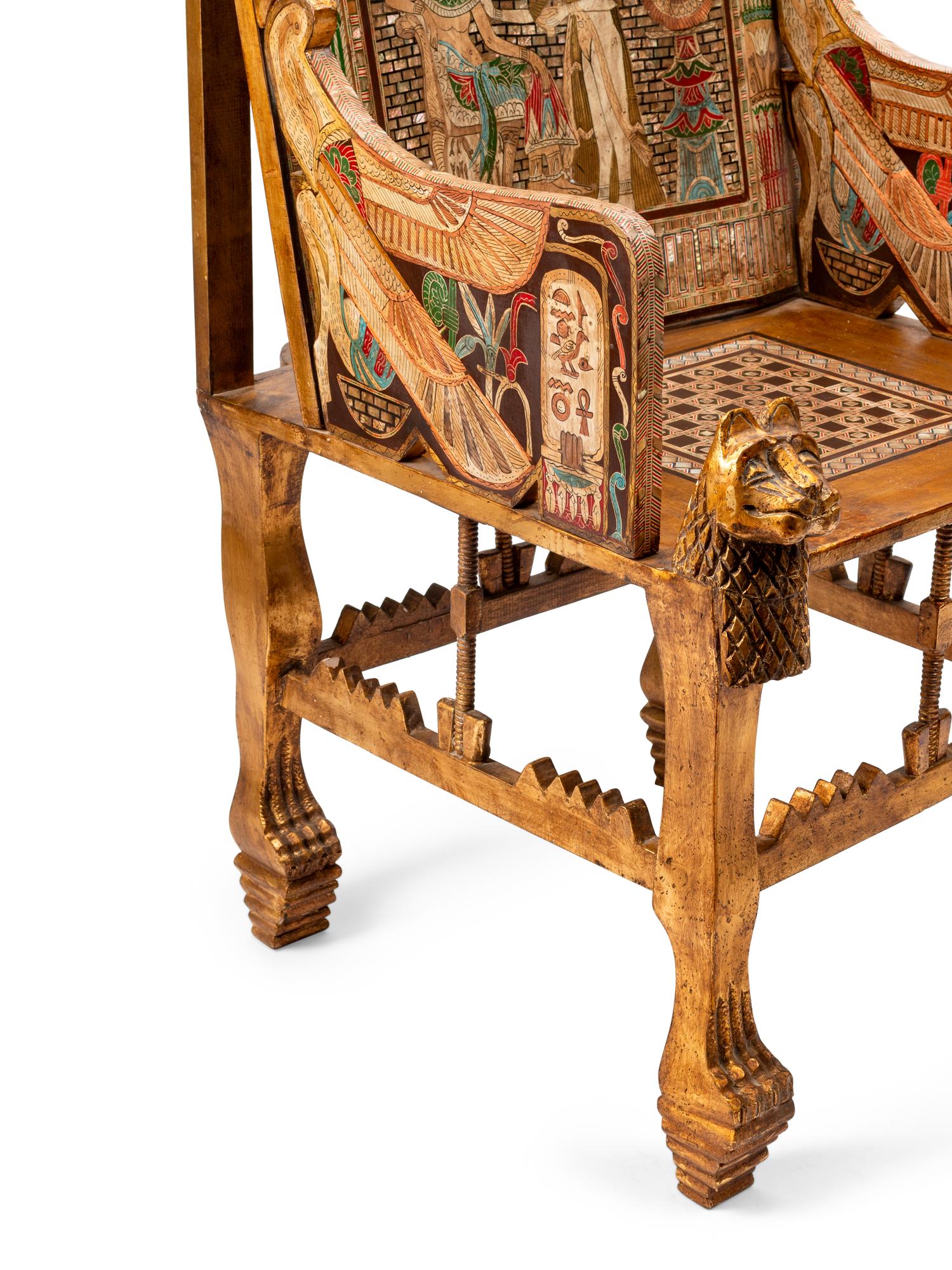 An Egyptian Style Parcel Gilt and Inlaid Throne Chair