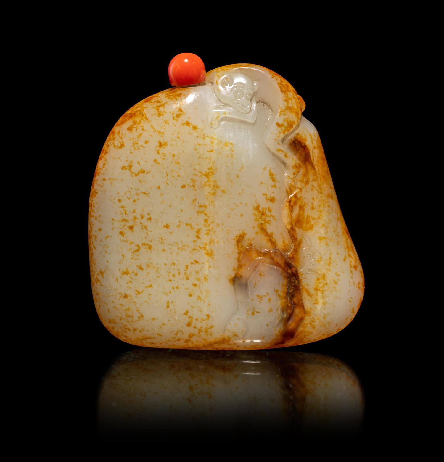 A Chinese Russet and White Jade 'Monkey and Peach' Snuff Bottle