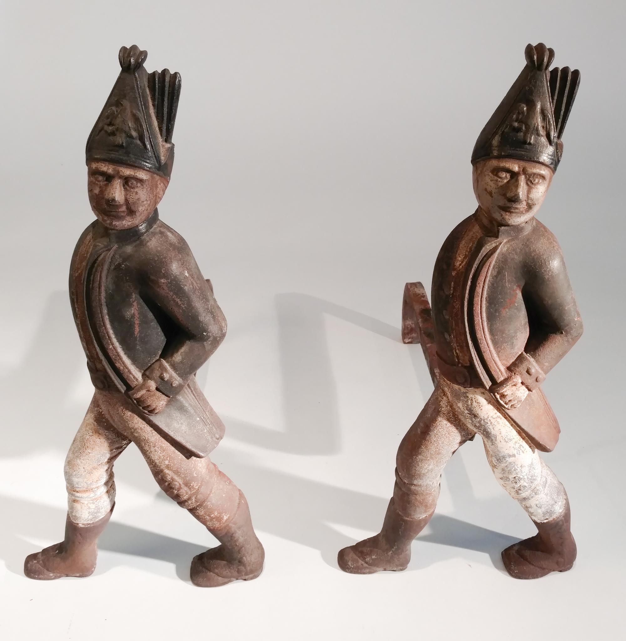 A Pair of Partially Painted Iron Andirons Height 21 inches.