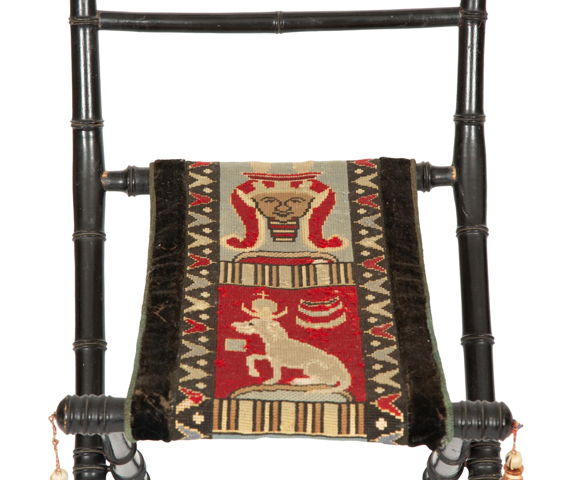 A Pair of Napoleon III Ebonized Folding Chairs with Needlepoint Seats