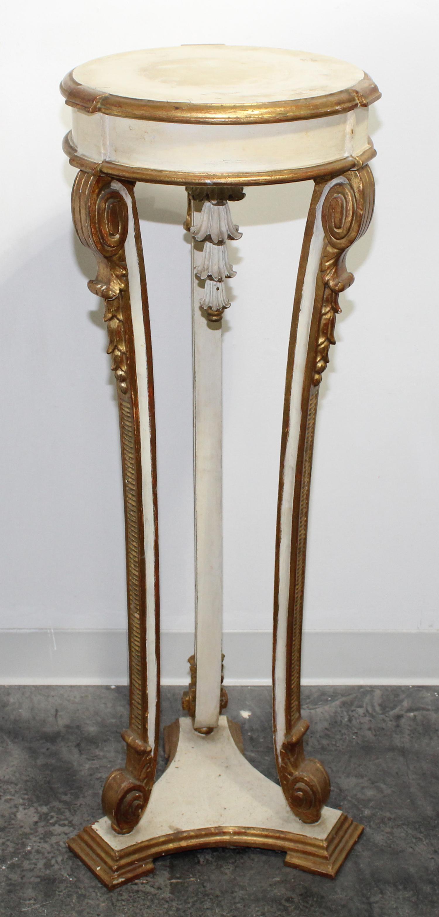A Neoclassical Painted and Parcel Gilt Pedestal. Height 43 inches.
