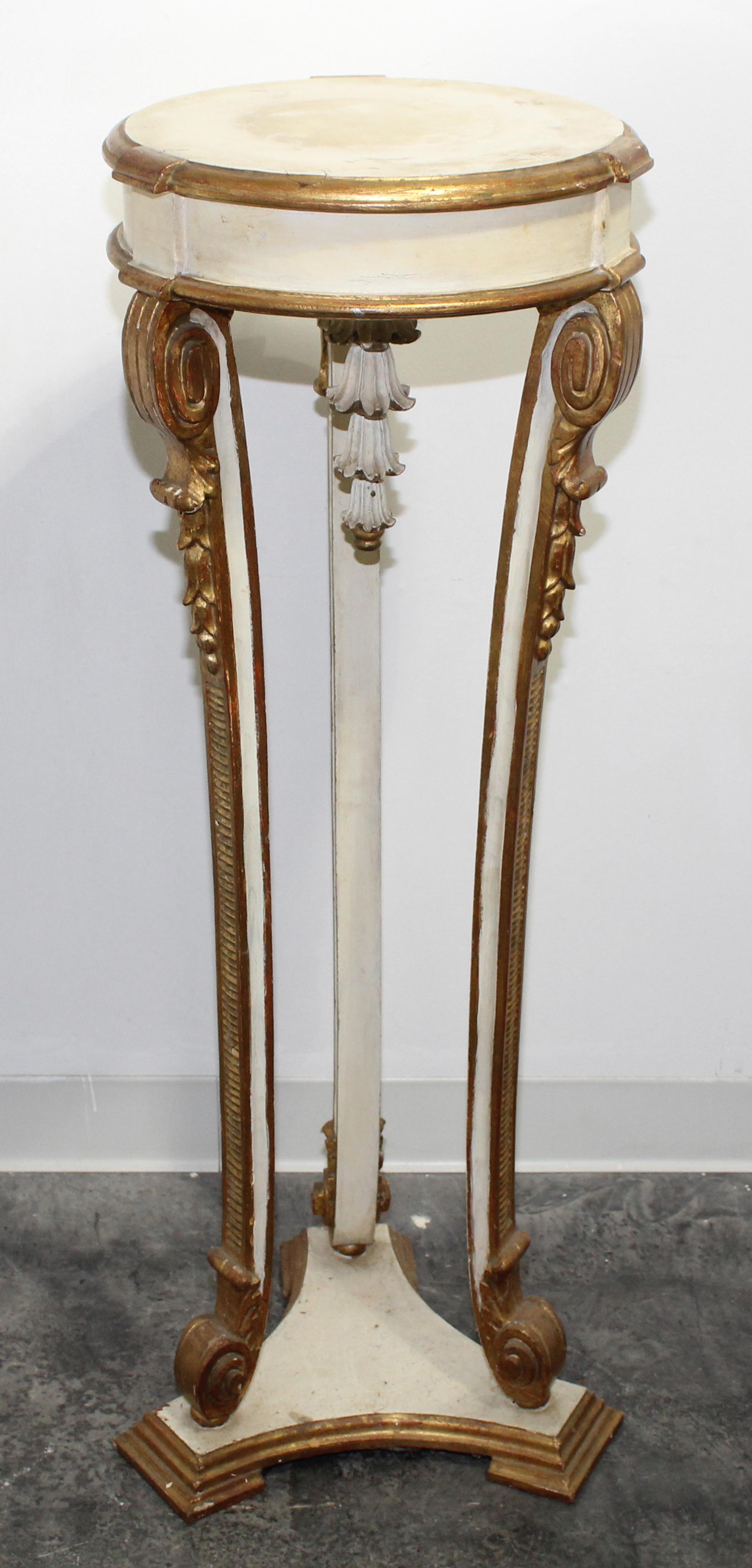 A Neoclassical Painted and Parcel Gilt Pedestal. Height 43 inches.