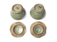 A Pair of Small Chinese Celadon Covered “Lotus” Jars
