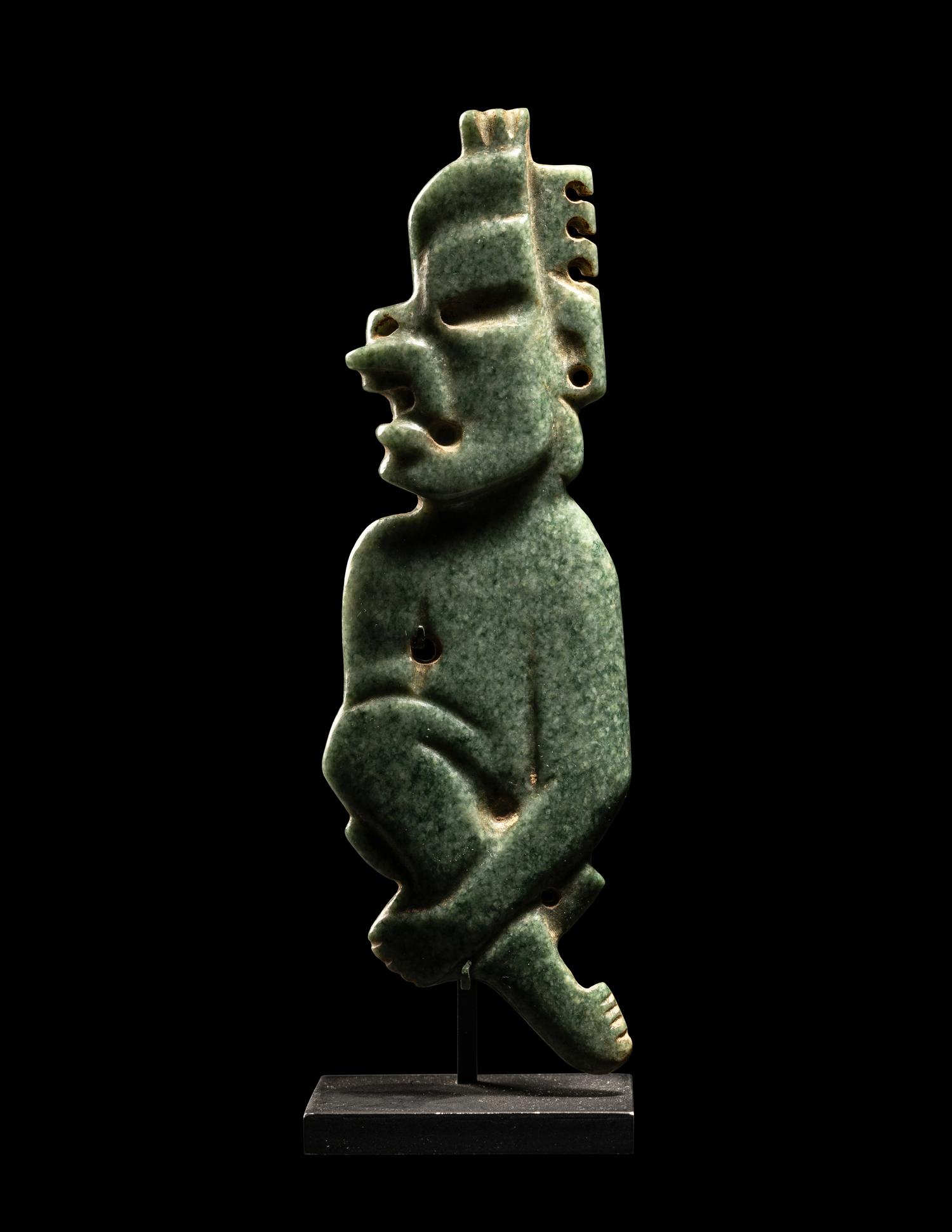 An Olmec Jade Transformation Figure with Crossed Legs