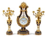 A French Gilt Bronze and Porcelain Clock Garniture Height of mantel clock 22 1/2 inches. — CIRCA 1900, RETAILED BY TIFFANY & CO.