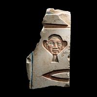 An Egyptian Painted Limestone Relief Fragment