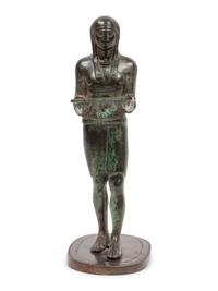 A Patinated Bronze Figure of an Egyptian as an Offering-Bearer