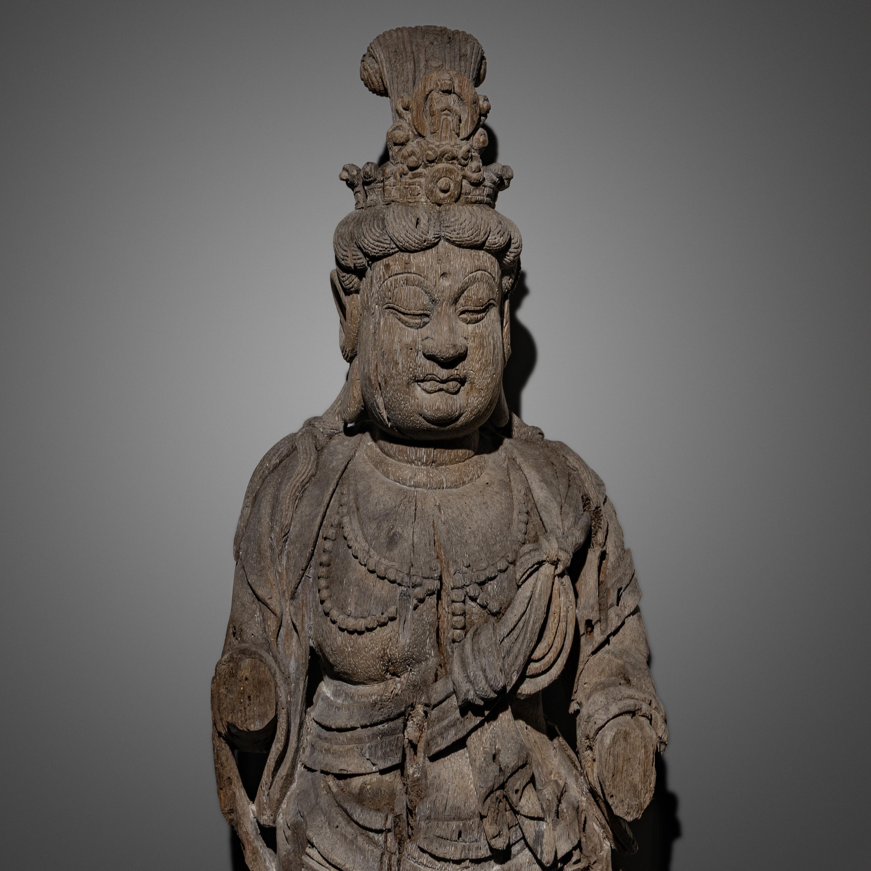 A Chinese Wood Carving of Guanyin Bodhisattva, Yuan Dynasty or Later — 元或以後 木雕觀音像