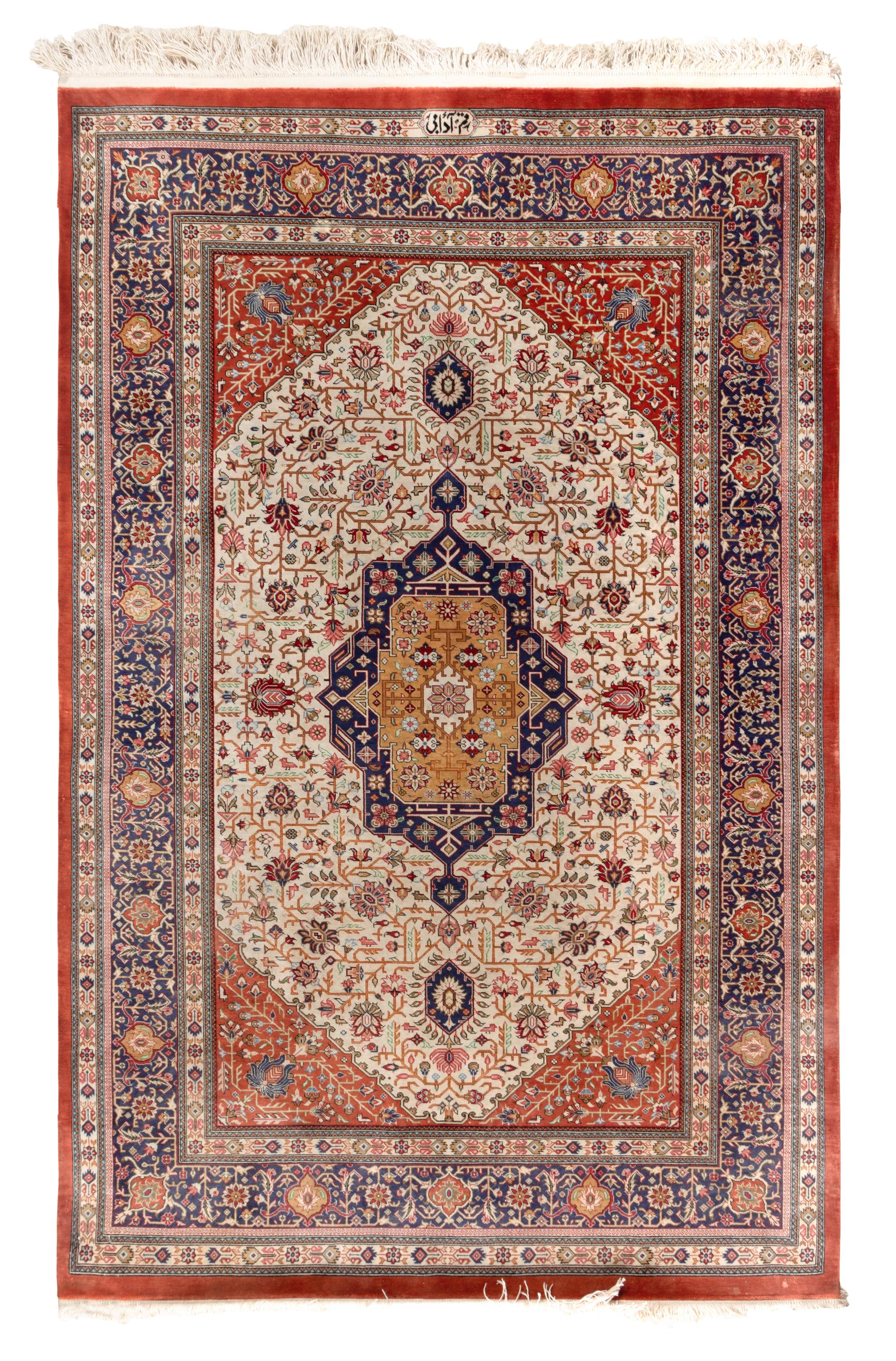 A Signed Silk Rug