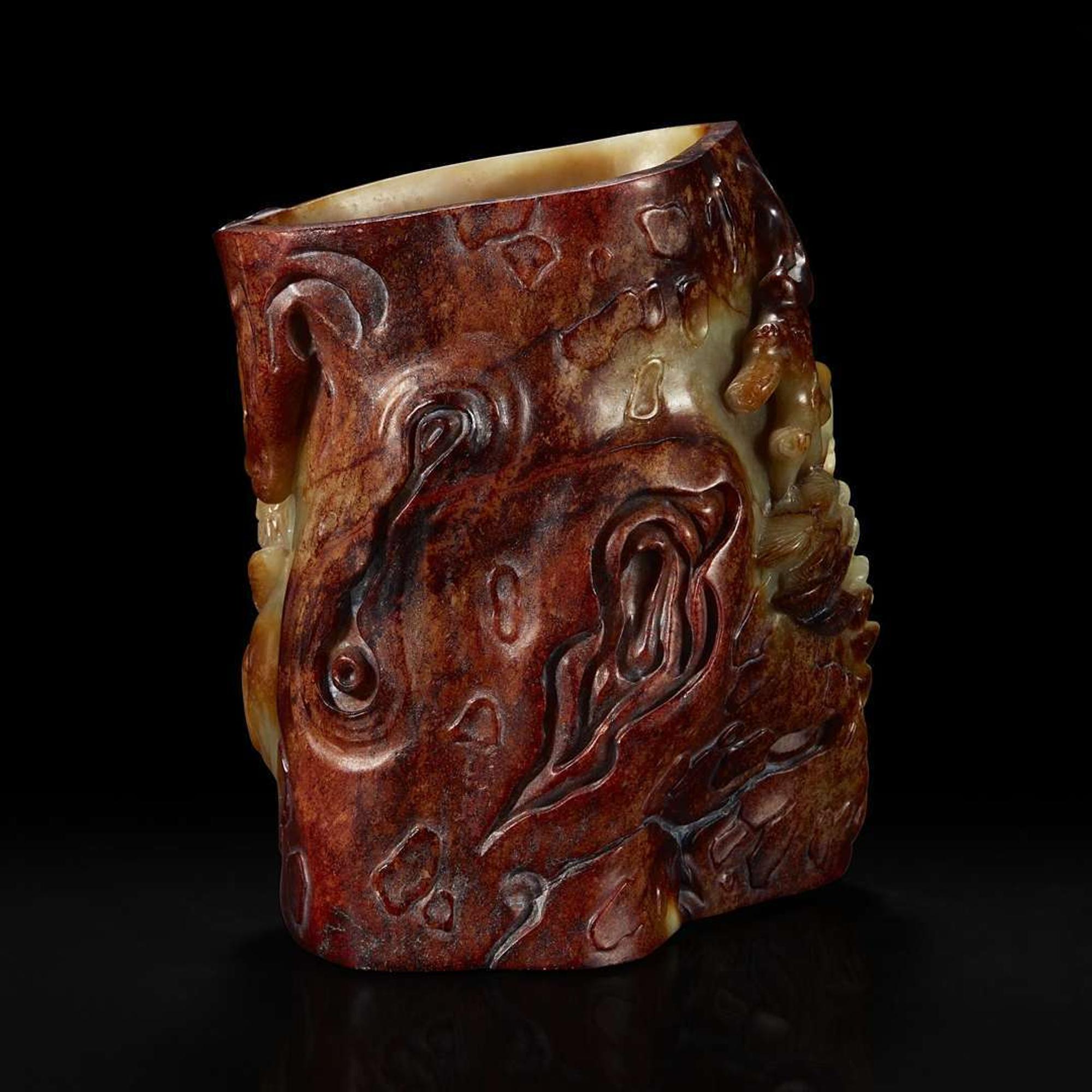A Chinese carved russet and celadon jade brush holder 青玉笔筒