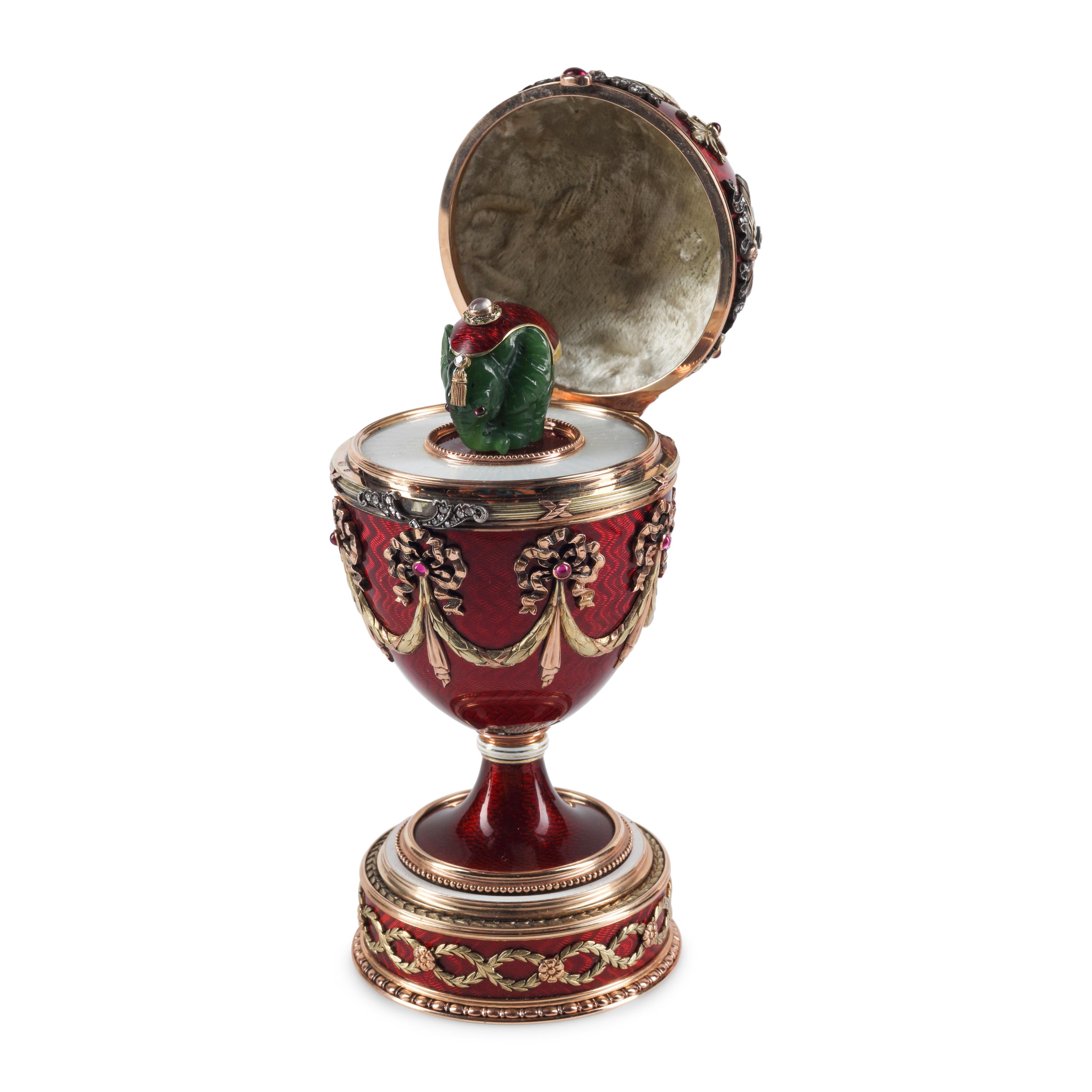 A 14-Karat Gold, Diamond, Gemstone and Guilloché Enamel Surprise Egg
