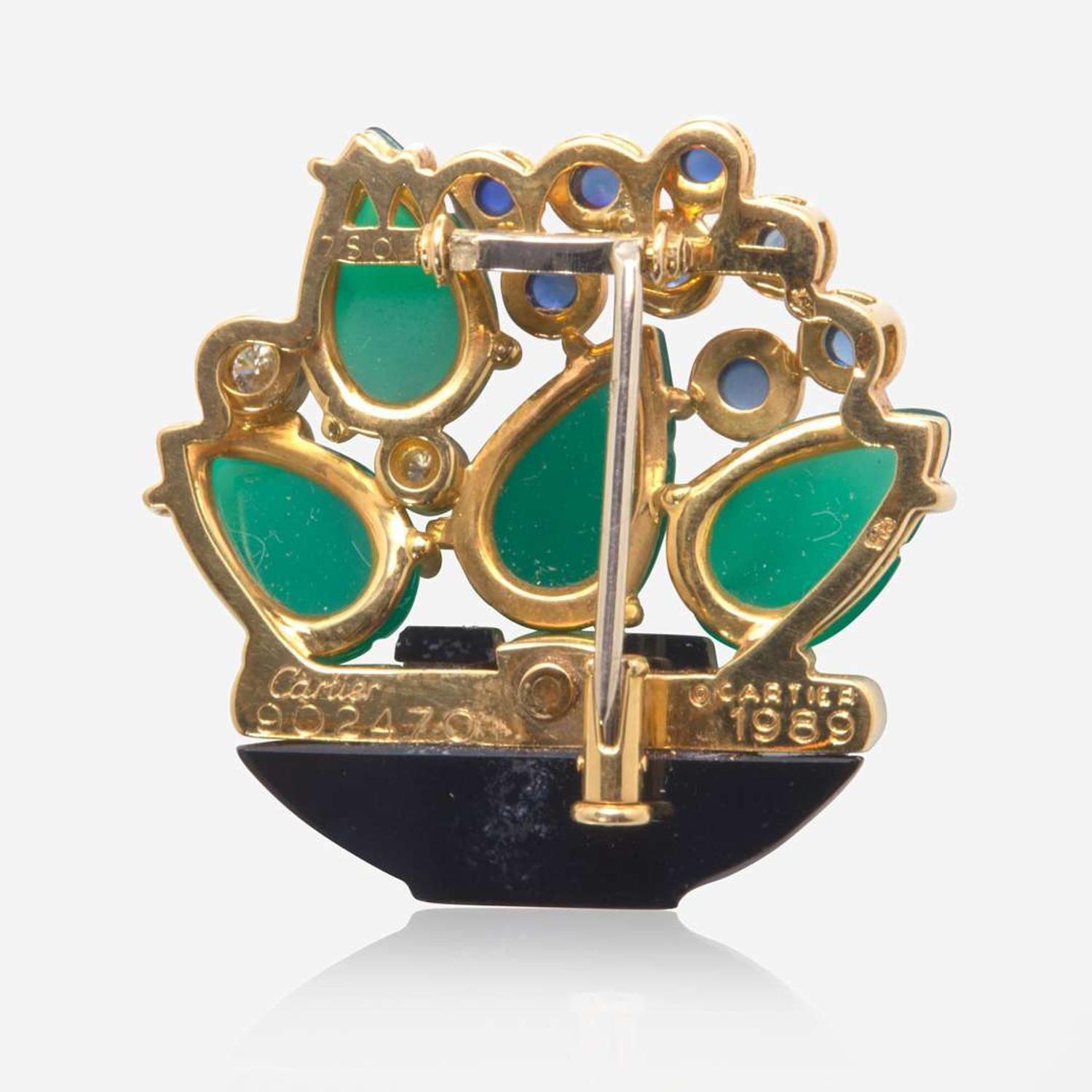 A Cartier Chrysophase, Sapphire, Diamond, and Onyx Pin Cartier c. 1989