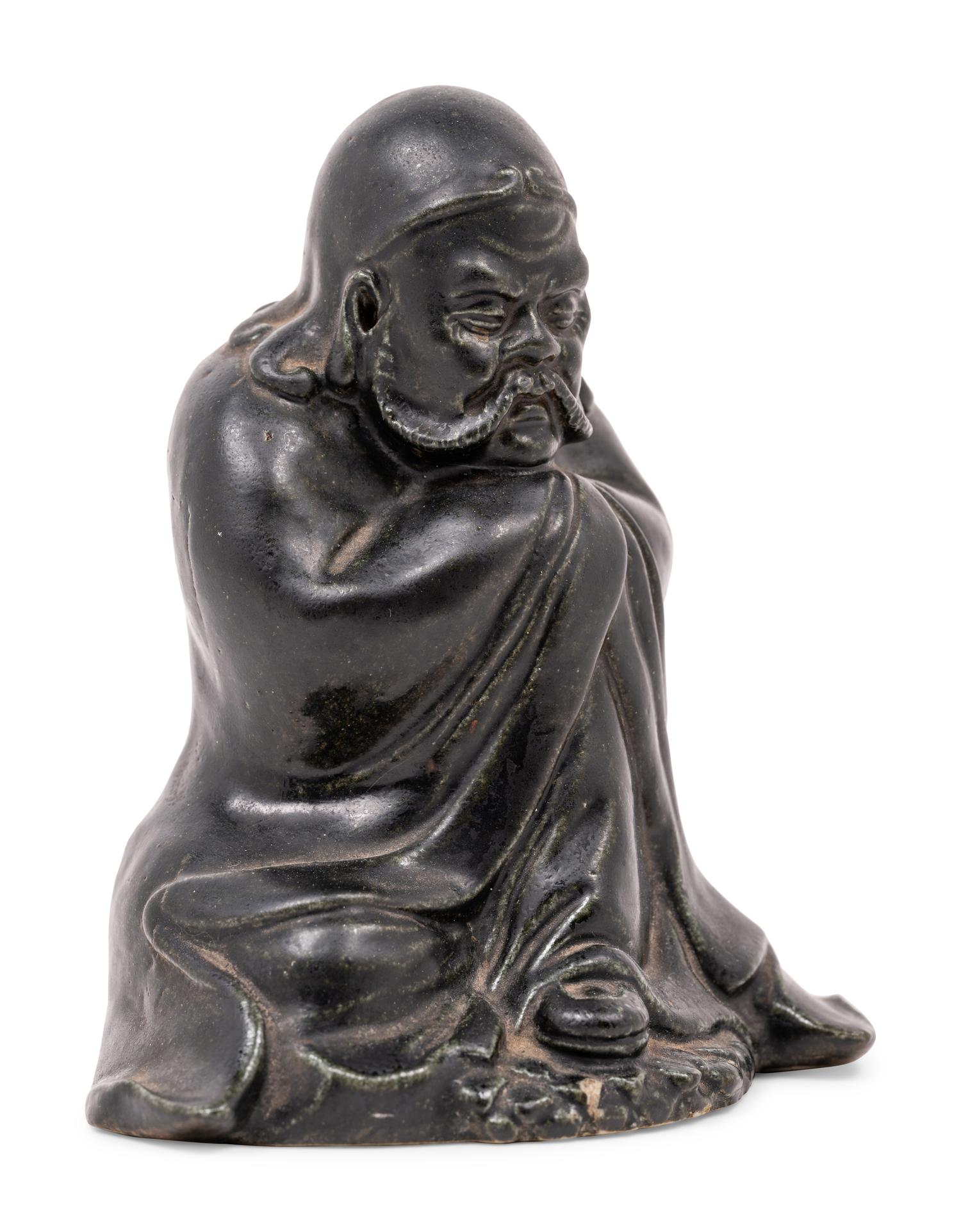 A Chinese Black Glazed Porcelain Figure of Seated Damo