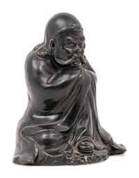 A Chinese Black Glazed Porcelain Figure of Seated Damo