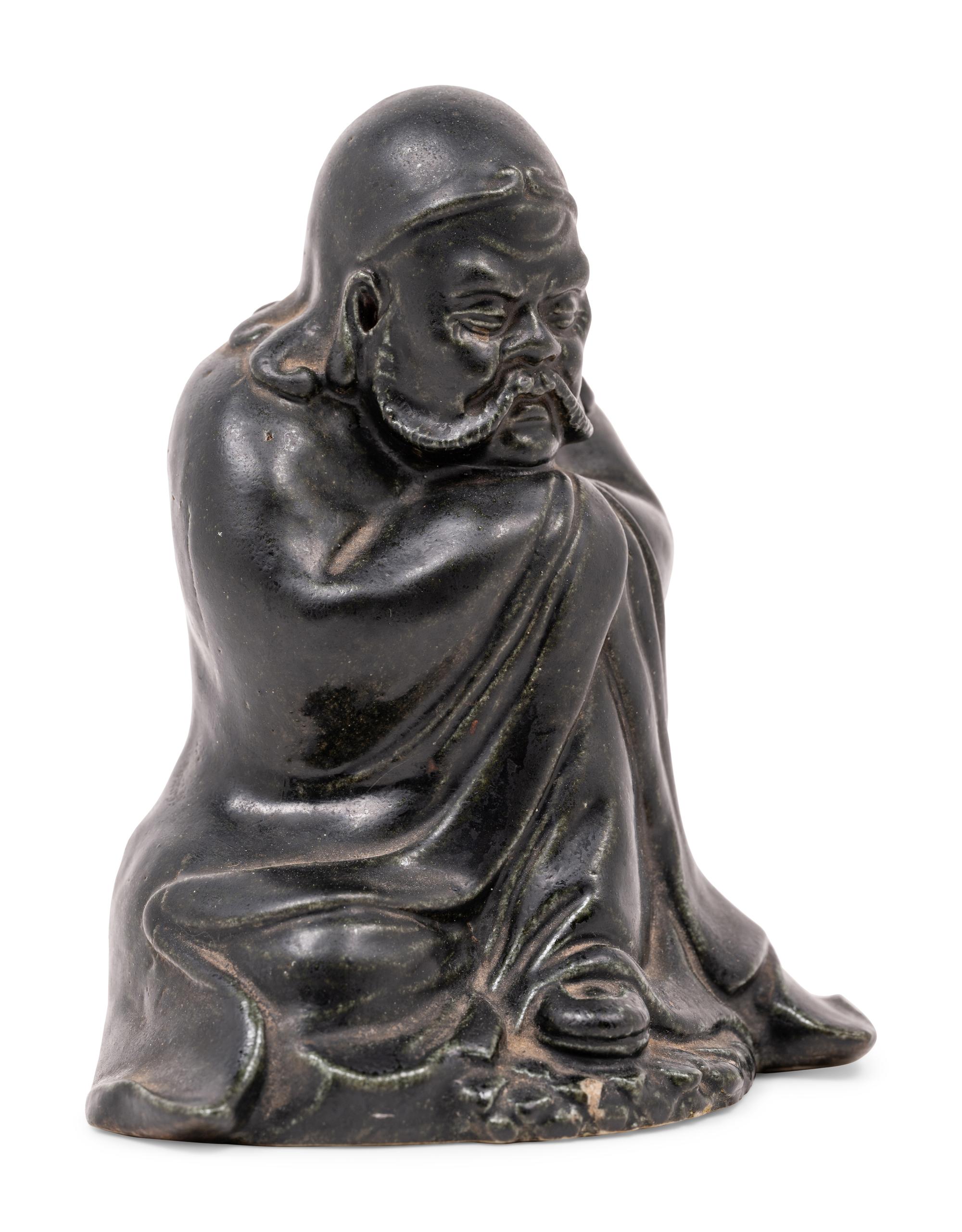 A Chinese Black Glazed Porcelain Figure of Seated Damo