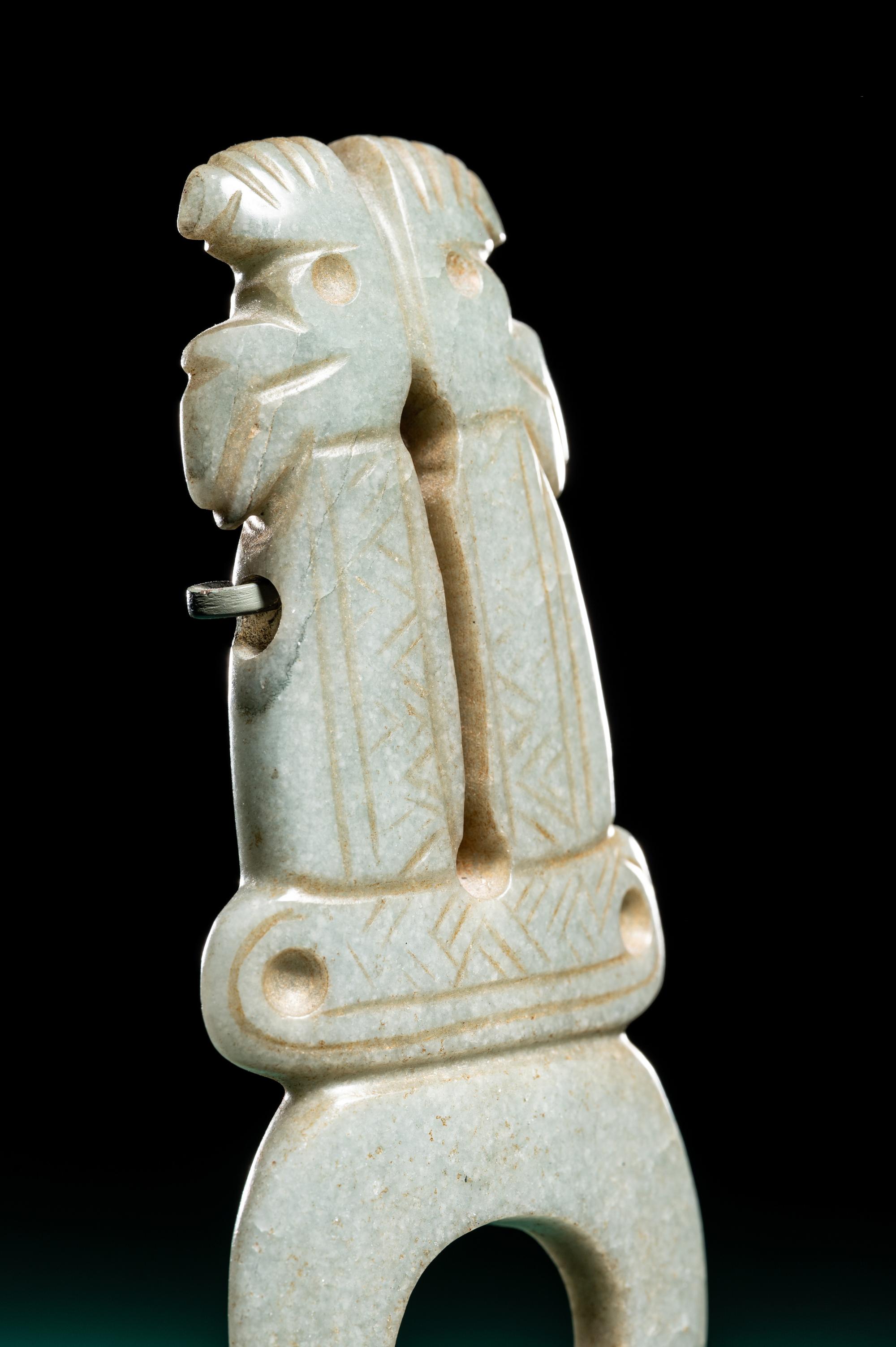 A Costa Rican Green Jade Double Avian Pendant