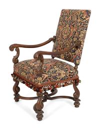 A Continental Louis XIV Style Carved Walnut Fauteuil a la Reine