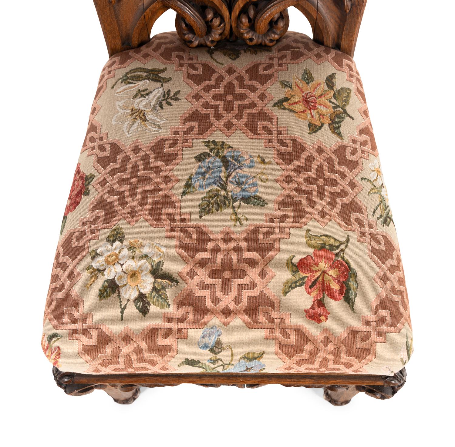 A Set of Six Rococo Revival Carved Oak Dining Chairs