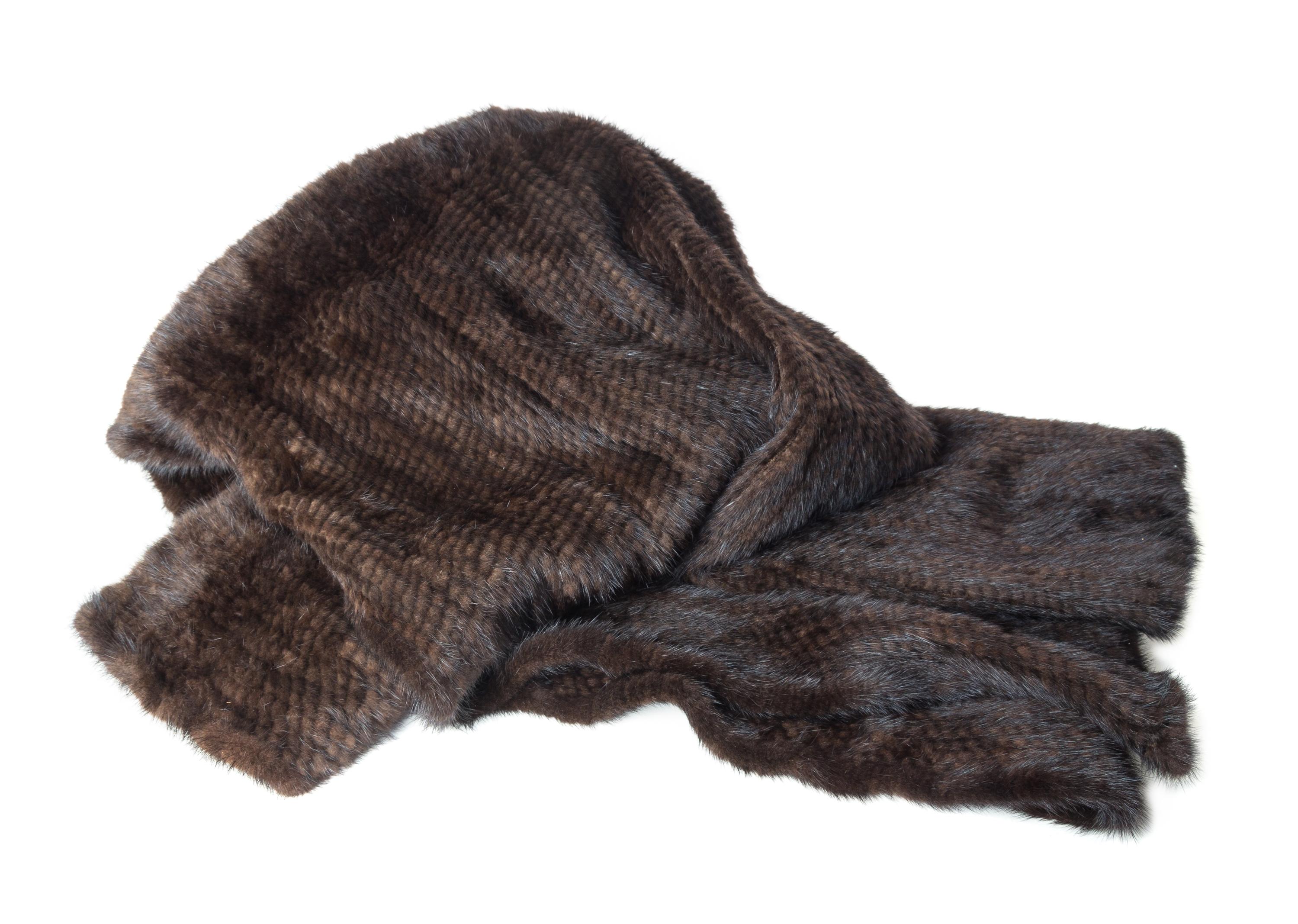 A Knitted Mink Throw 5 feet 8 inches x 4 feet 1 inch. — 20TH CENTURY
