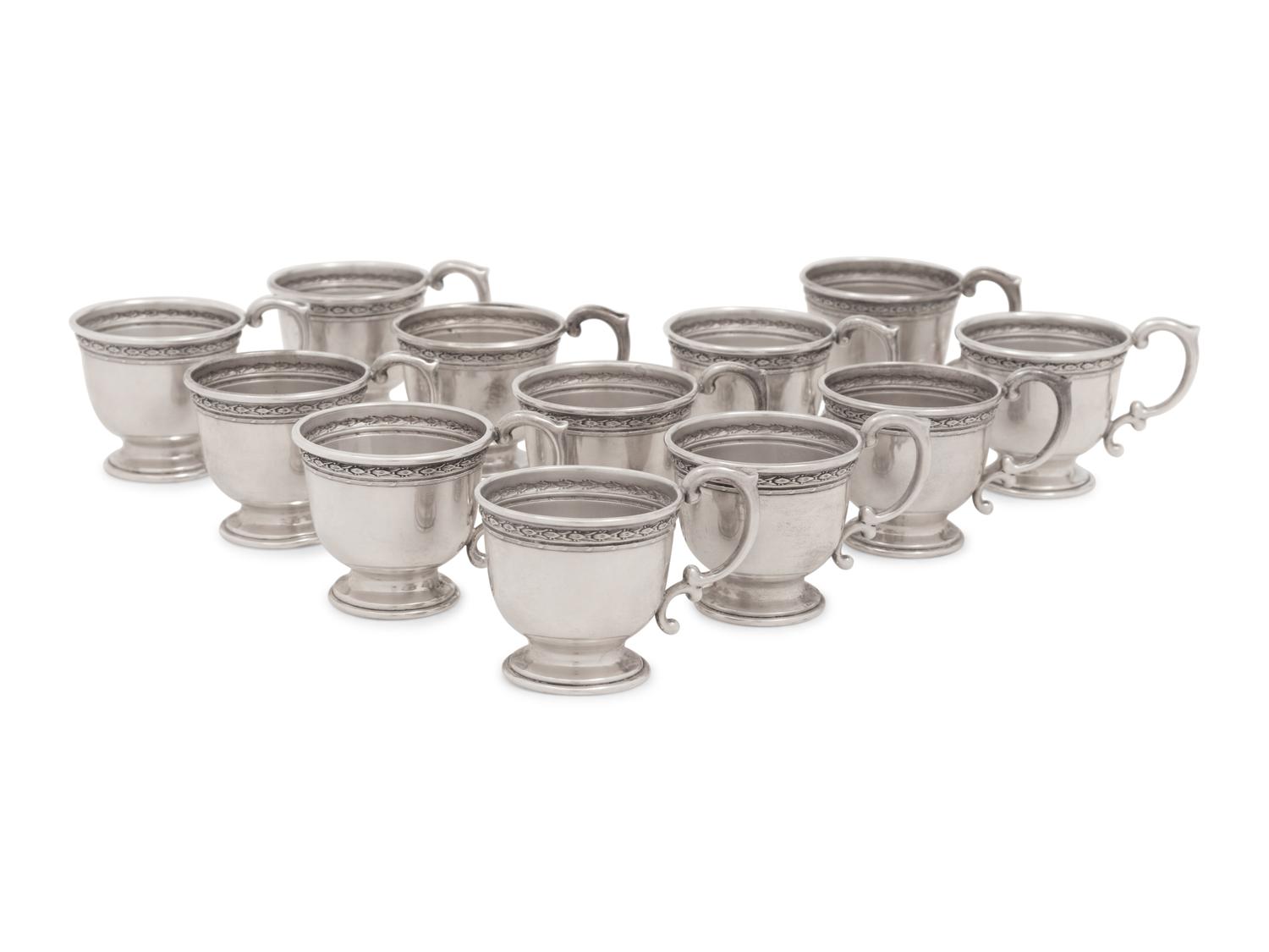 A Group of American Silver Cups and Saucers