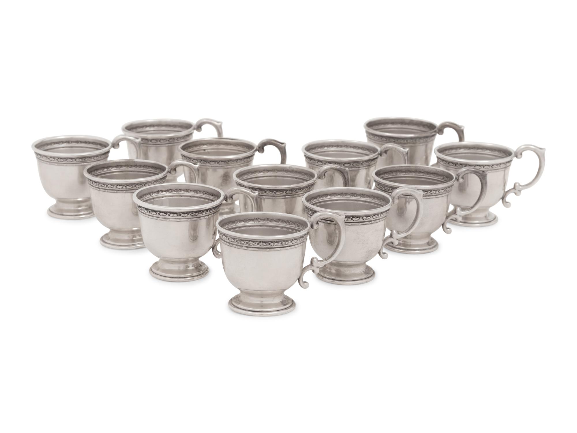 A Group of American Silver Cups and Saucers