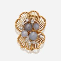 A star sapphire, diamond, and eighteen karat gold brooch