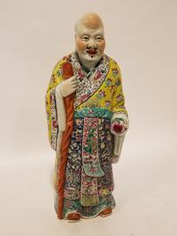 A Large Famille Rose Figure. Height 22 3/4 inches.