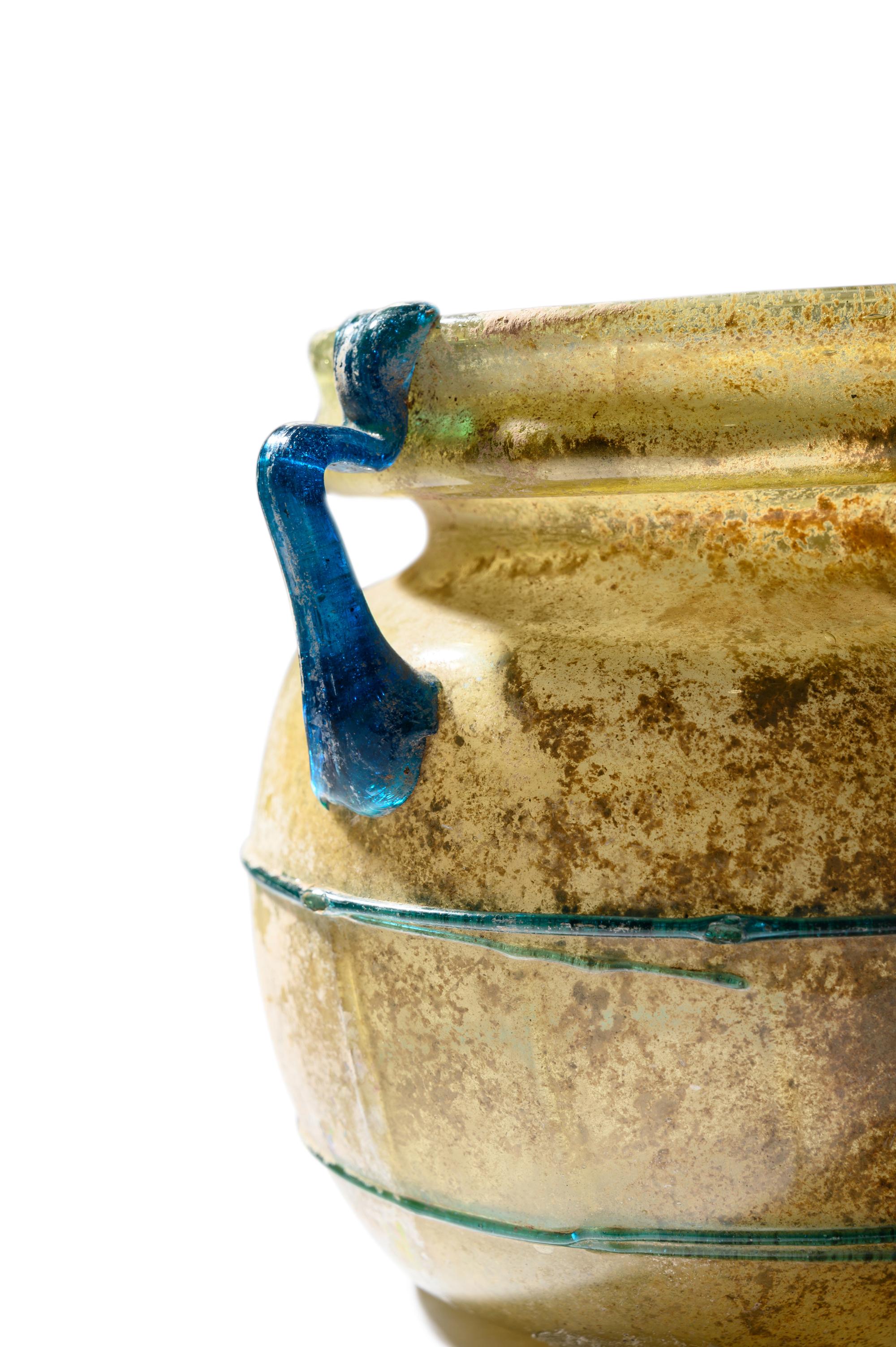 A Roman Yellow Glass Jar with Blue Spiral Trail