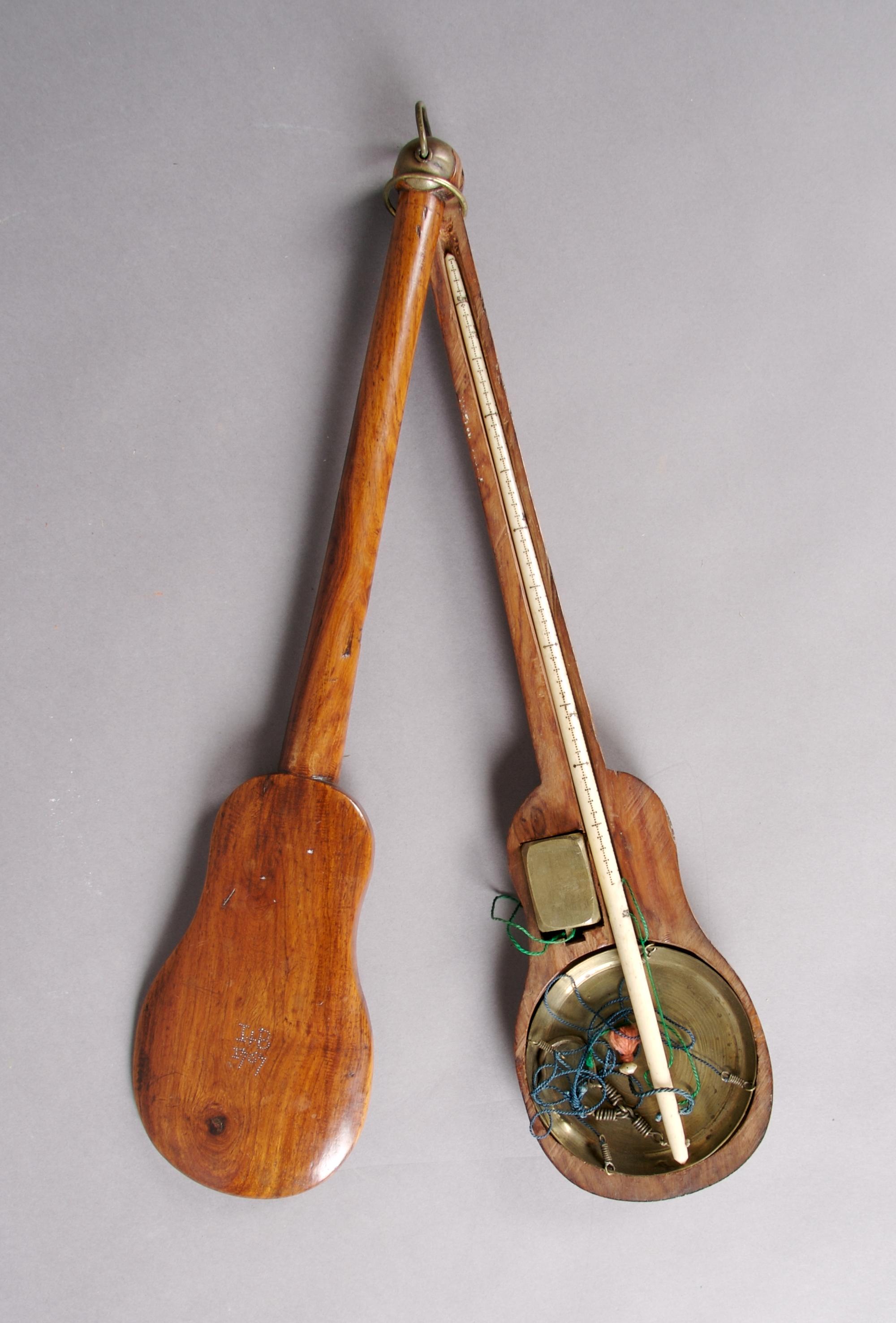 An English Ivory and Brass Balance Scale, Length overall 13 5/8 inches.
