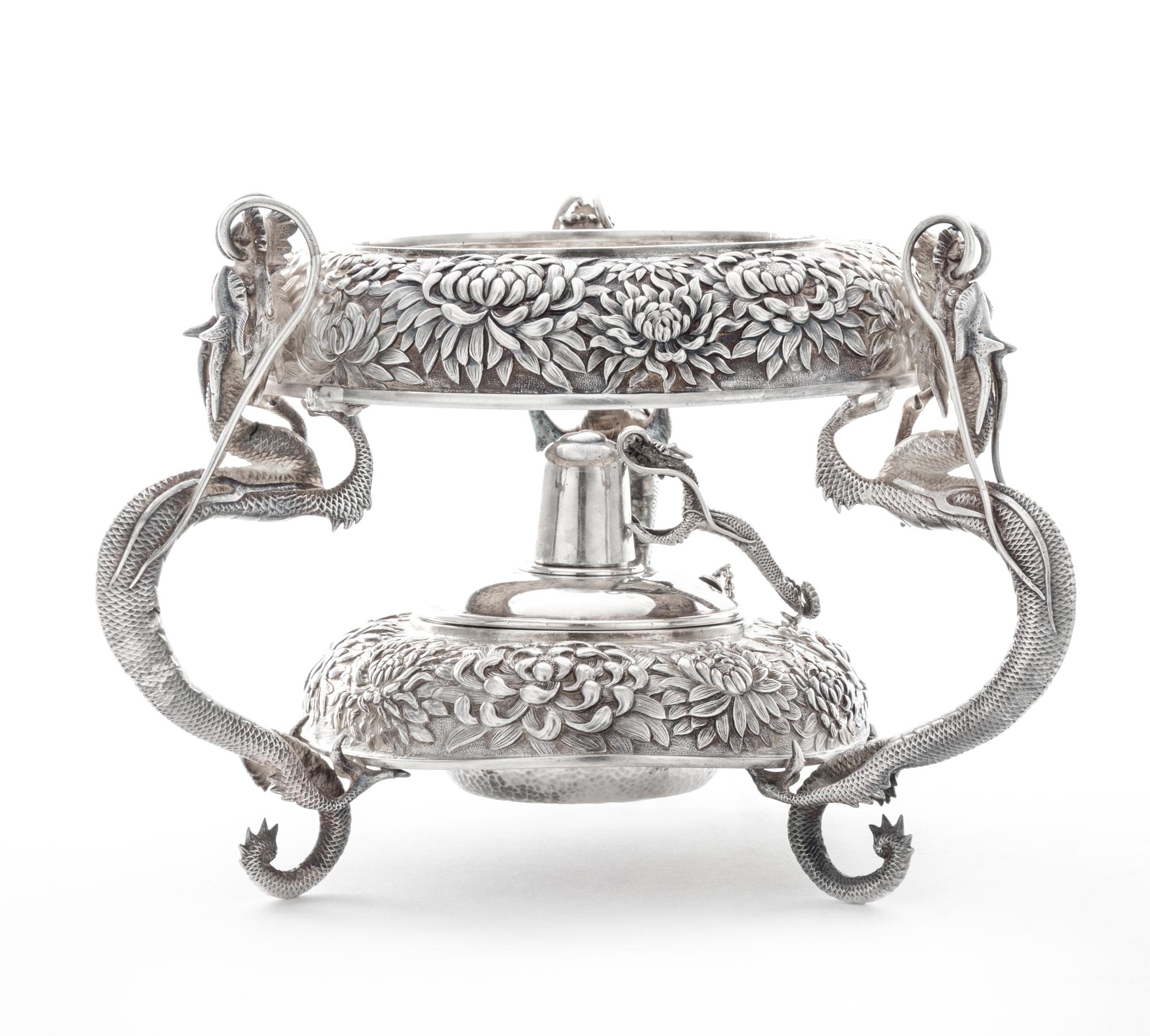 A Japanese Silver Water Kettle Stand, Y. Konoike, Yokohama, Meiji Period, the kettle stand worked to show repousse chrysanthemum decora