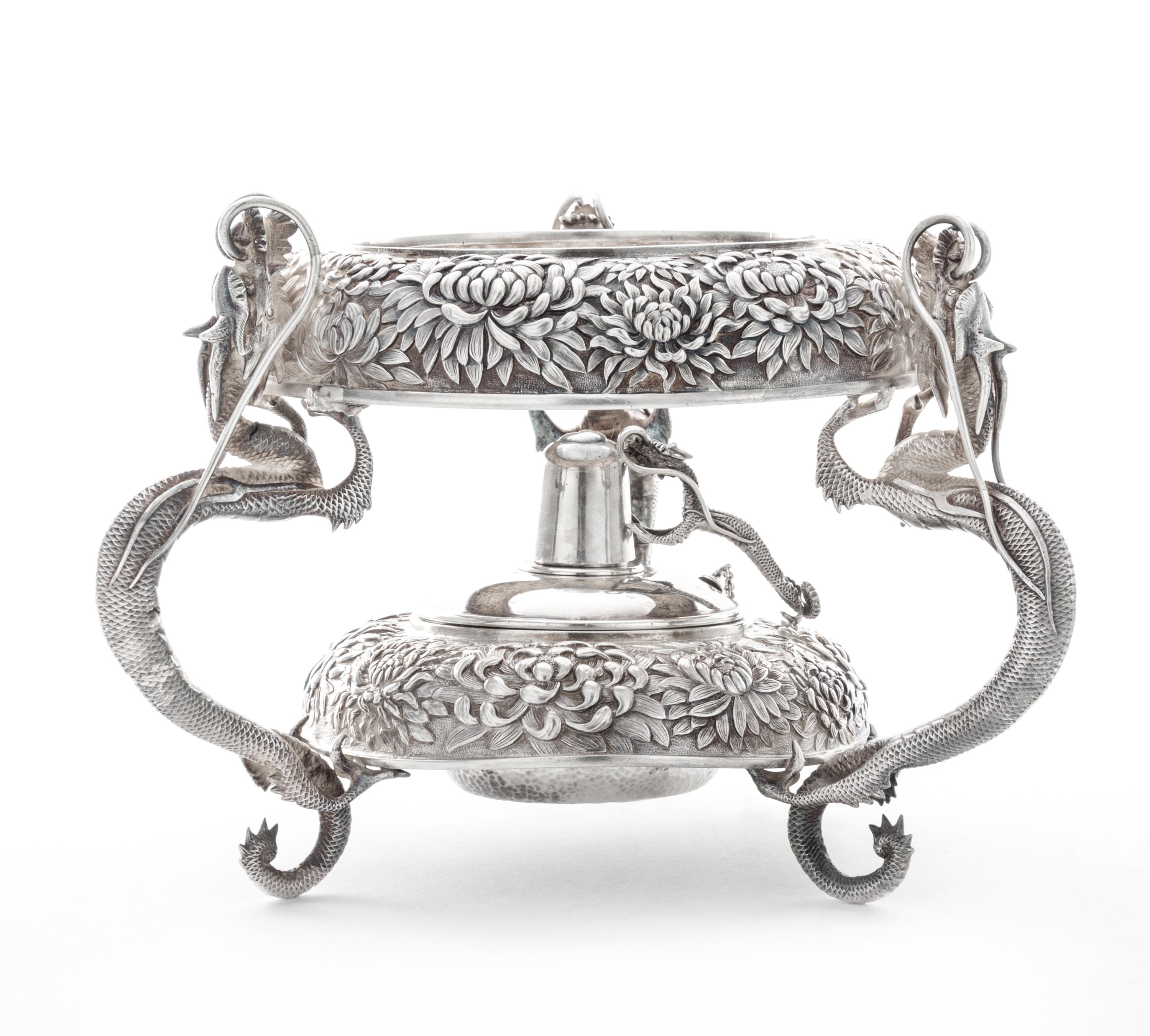 A Japanese Silver Water Kettle Stand, Y. Konoike, Yokohama, Meiji Period, the kettle stand worked to show repousse chrysanthemum decora