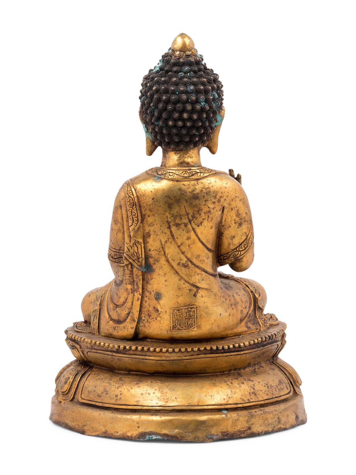 A Gilt Bronze Seated Buddha Figure on Lotus Flower Base