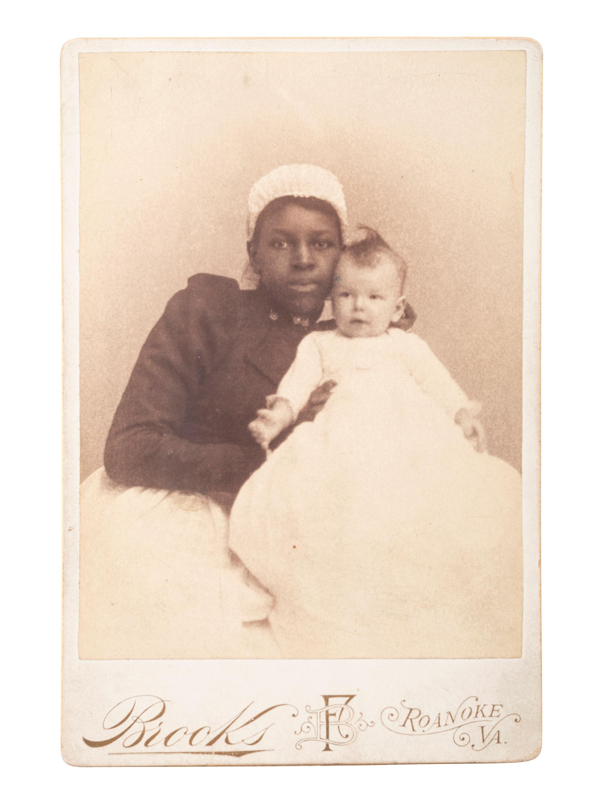 [EARLY PHOTOGRAPHY]. A group of 3 cabinet photographs of African American women and white infants, incl. 2 views taken during the same sitting.