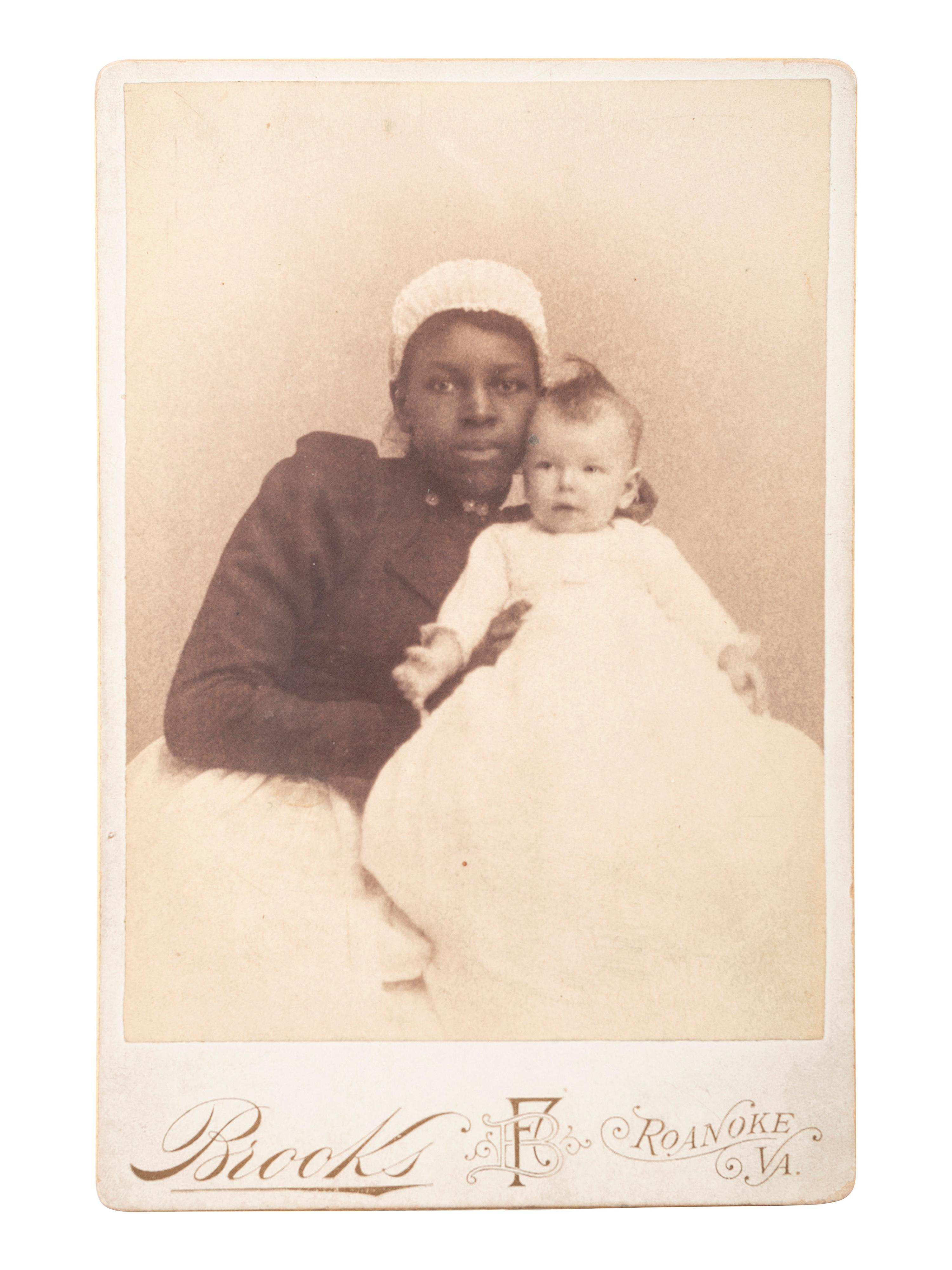 [EARLY PHOTOGRAPHY]. A group of 3 cabinet photographs of African American women and white infants, incl. 2 views taken during the same sitting.